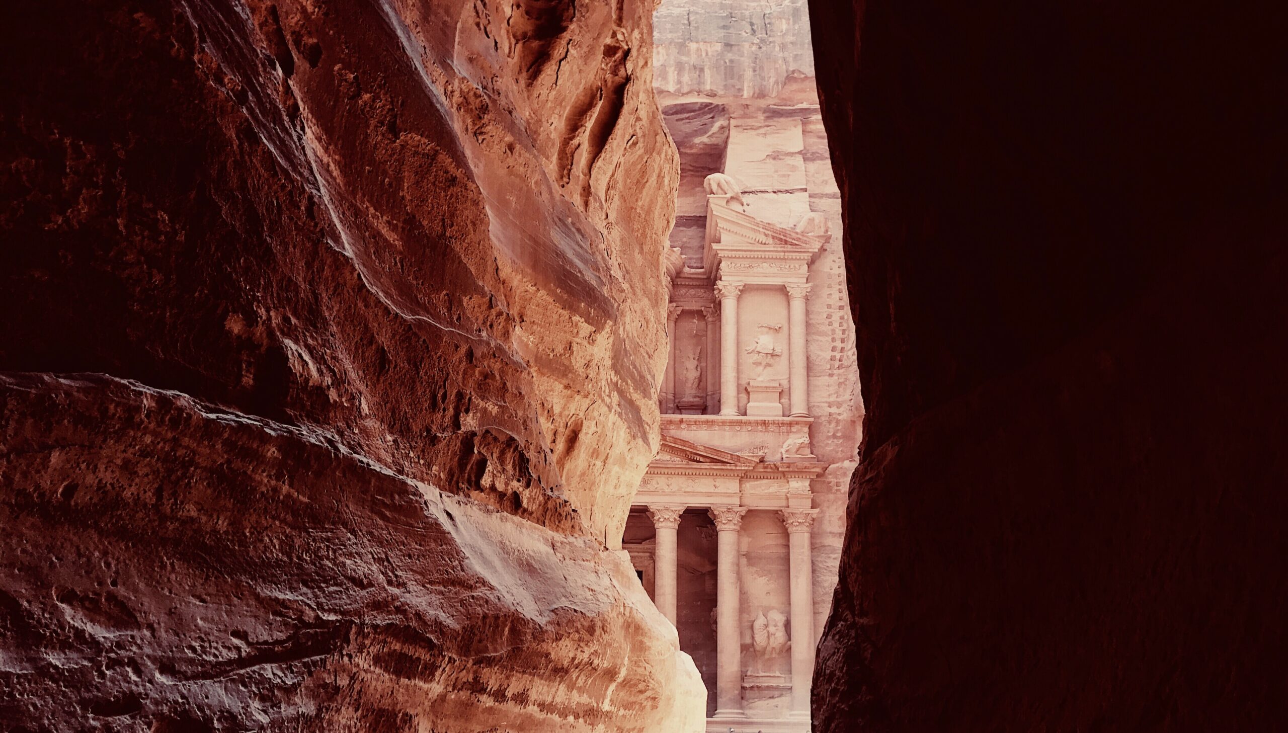 The Siq: Start your journey by walking through the Siq, a narrow canyon that serves as the main entrance to Petra. The towering cliffs on either side create a dramatic and awe-inspiring entrance.