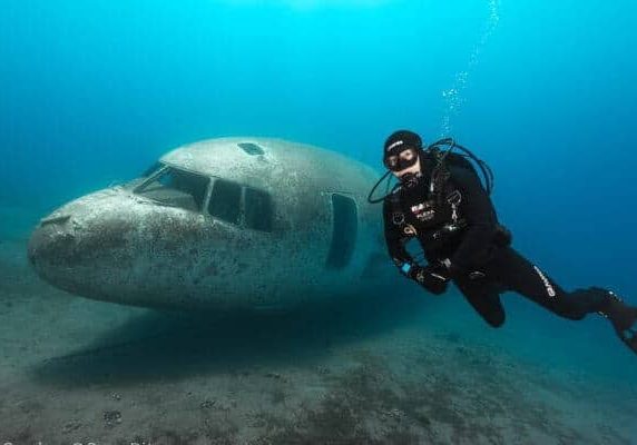 Tourist Diving Beside a Sunken Aircraft in The Waters of Aqaba.